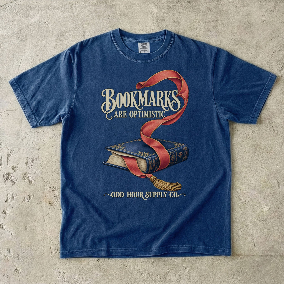 True Navy T-shirt featuring a blue book, red bookmark and BOOKMARKS ARE OPTIMISTIC by Odd Hour Supply Co.
