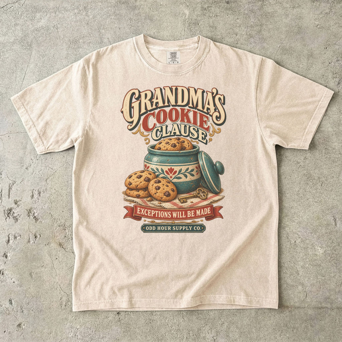 Ivory Comfort Colors 1717 T-shirt with a cookie jar, cookies, a key, and Grandma’s Cookie Clause and Exceptions Will Be Made lettering.
