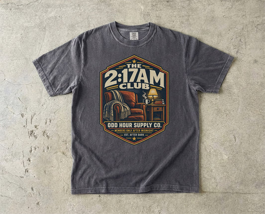The 2:17AM Club vintage badge T-shirt in Pepper, Comfort Colors 1717 front view