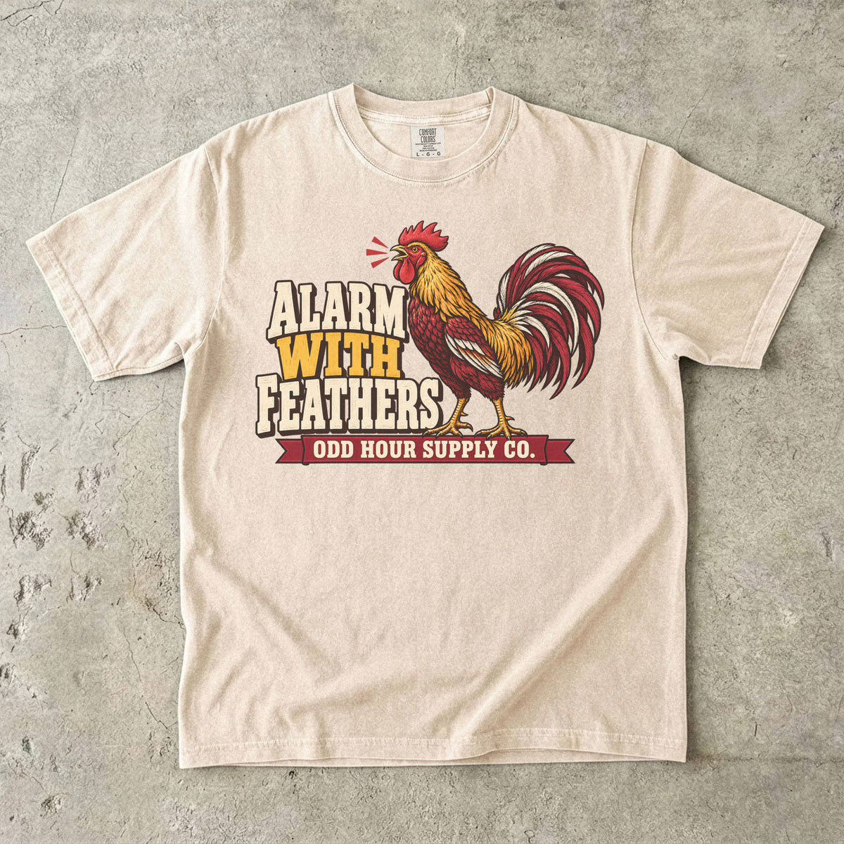 Ivory Comfort Colors 1717 T-shirt with the Alarm With Feathers graphic, front view