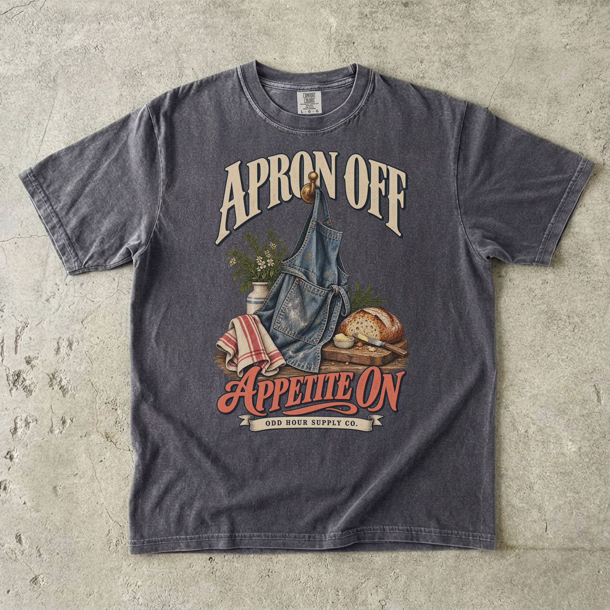 Pepper T-shirt featuring a denim apron, fresh bread and APRON OFF APPETITE ON by Odd Hour Supply Co.
