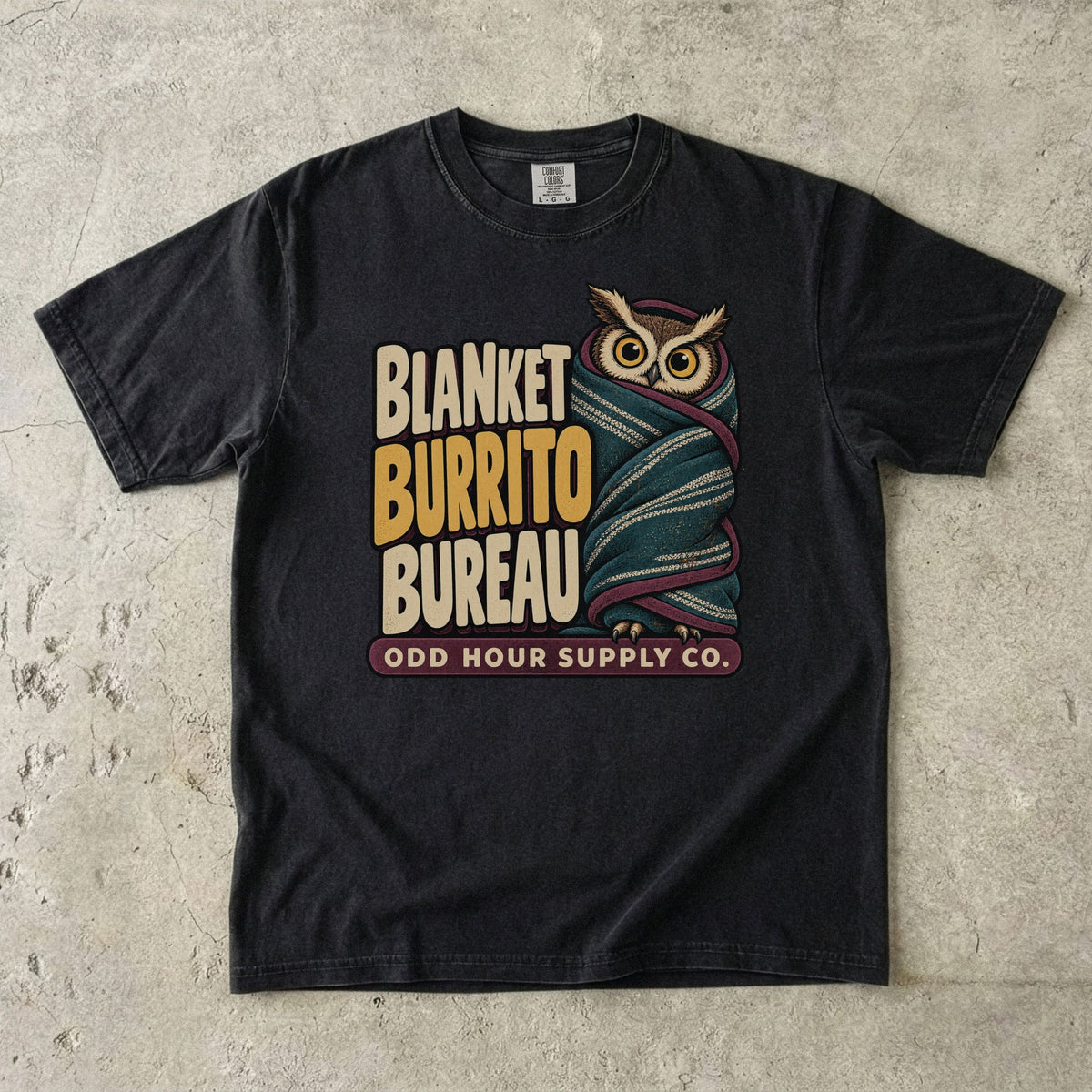 Black Comfort Colors 1717 T-shirt with the Blanket Burrito Bureau graphic, front view