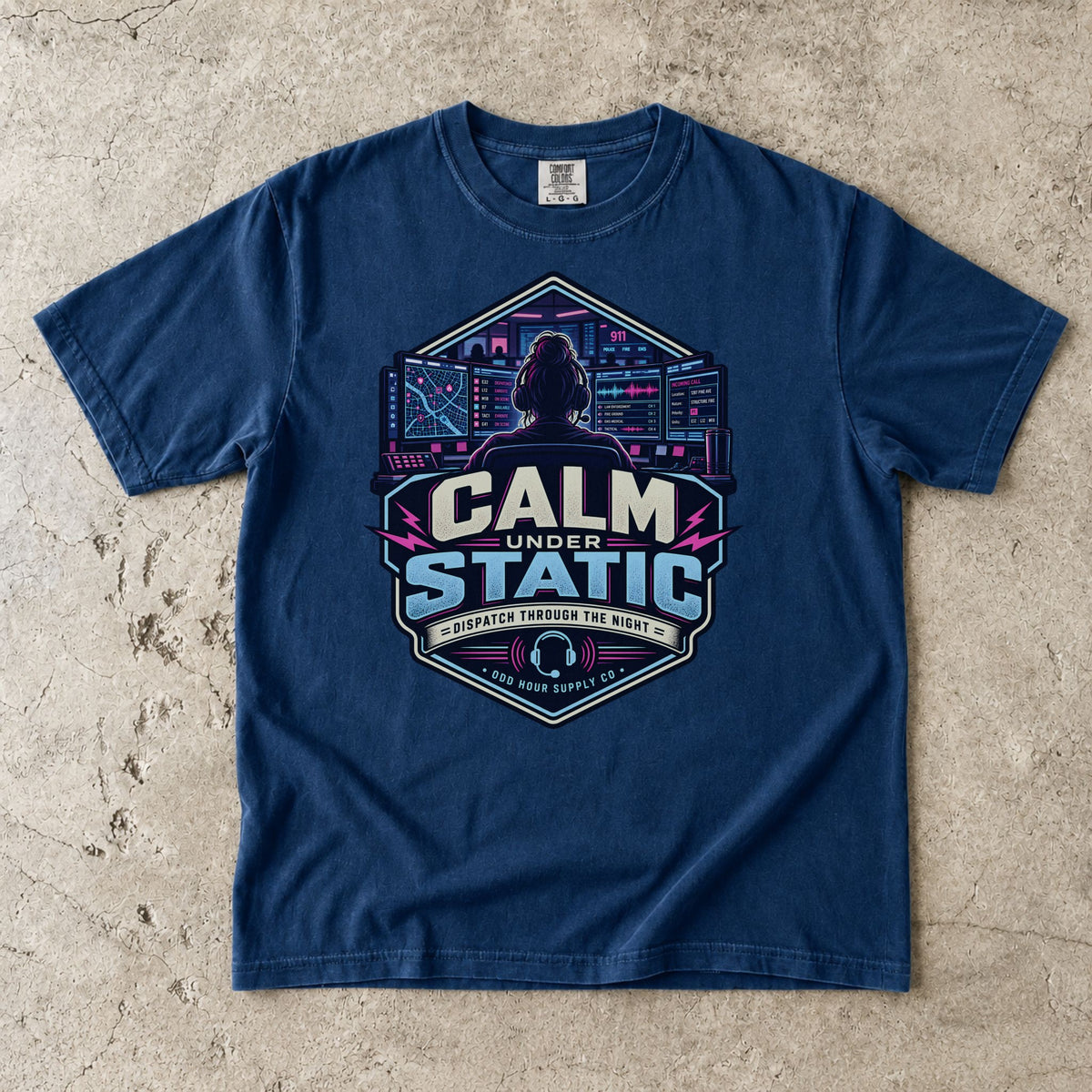Navy Comfort Colors 1717 T-shirt with Calm Under Static front graphic, dispatcher, control-room screens and cyan-magenta details.