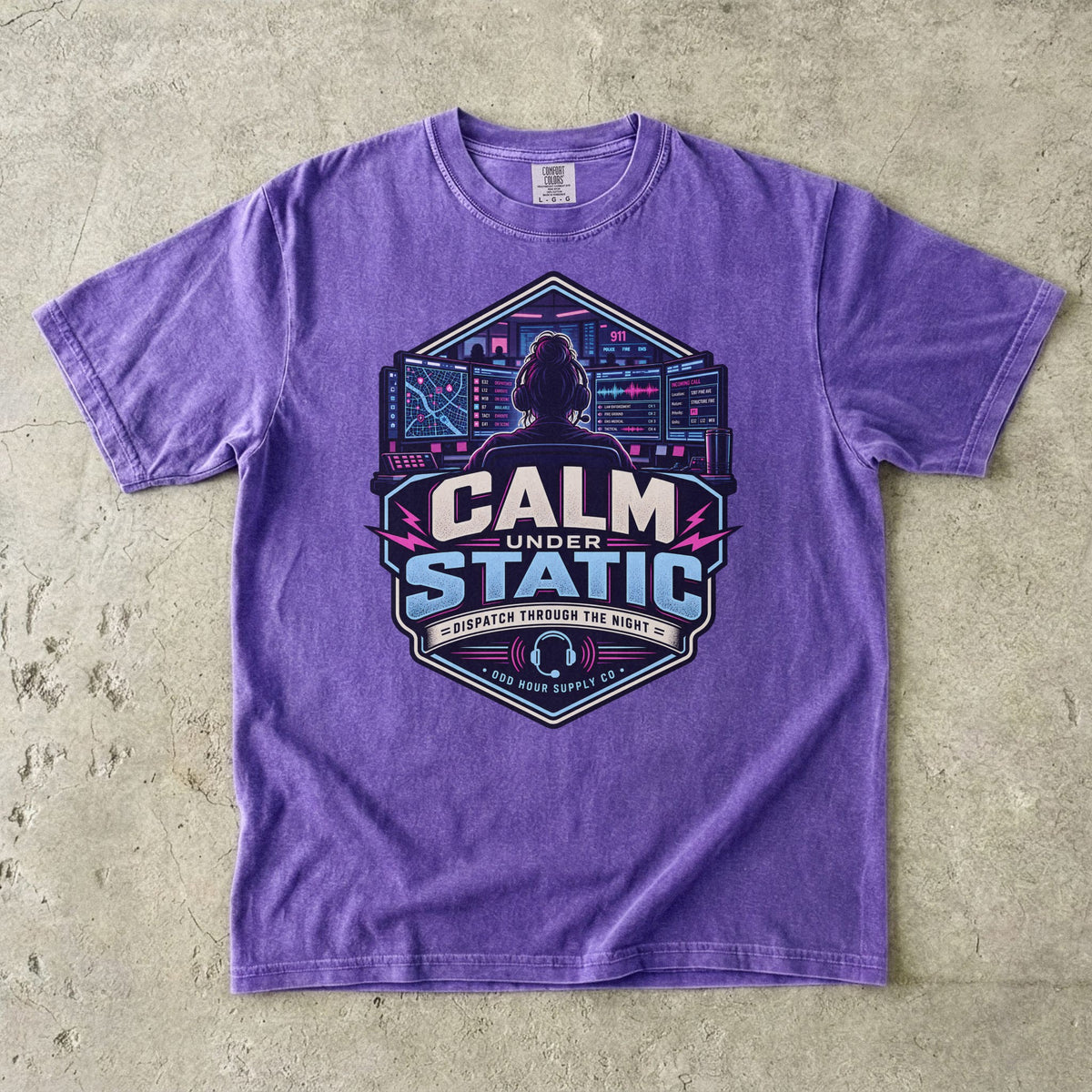 Violet Comfort Colors 1717 T-shirt with Calm Under Static front graphic, dispatcher, control-room screens and cyan-magenta details.