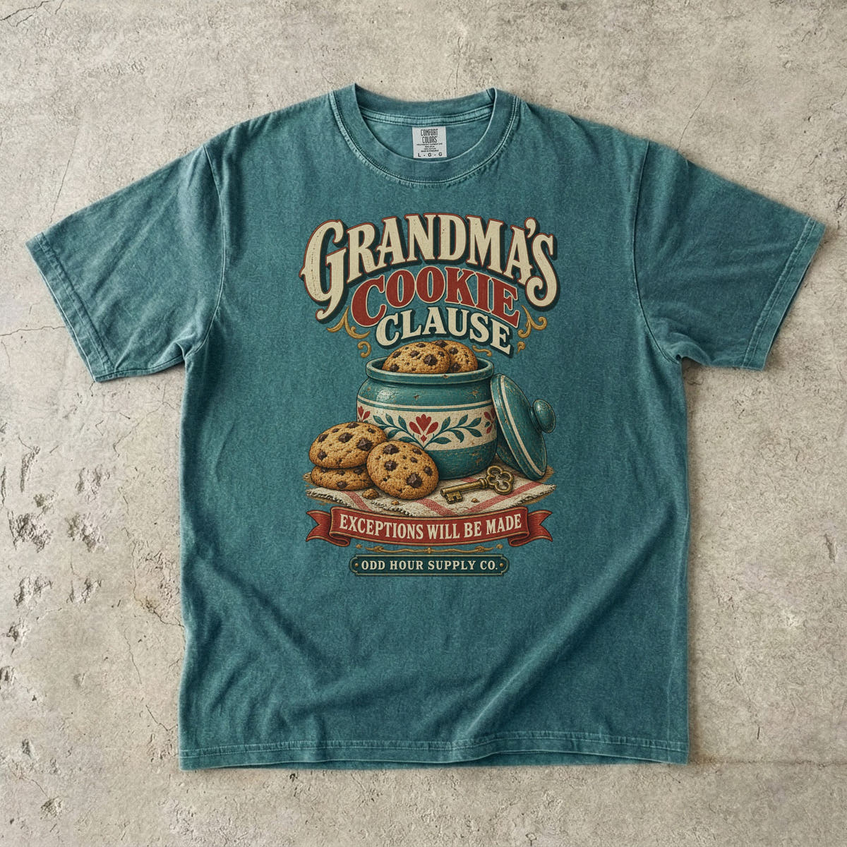 Blue Spruce Comfort Colors 1717 T-shirt with a cookie jar, cookies, a key, and Grandma’s Cookie Clause and Exceptions Will Be Made lettering.