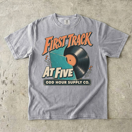 Grey Comfort Colors 1717 T-shirt with the First Track at Five graphic, front view