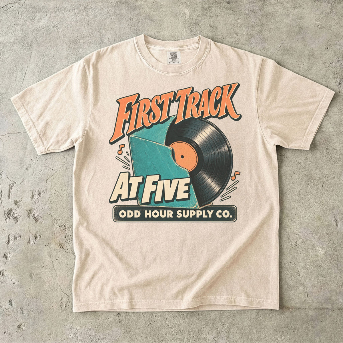 Ivory Comfort Colors 1717 T-shirt with the First Track at Five graphic, front view
