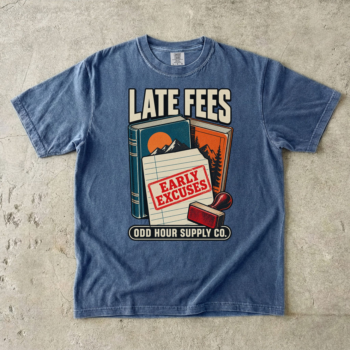 Denim T-shirt with books, a library card, a red stamp and LATE FEES EARLY EXCUSES by Odd Hour Supply Co.