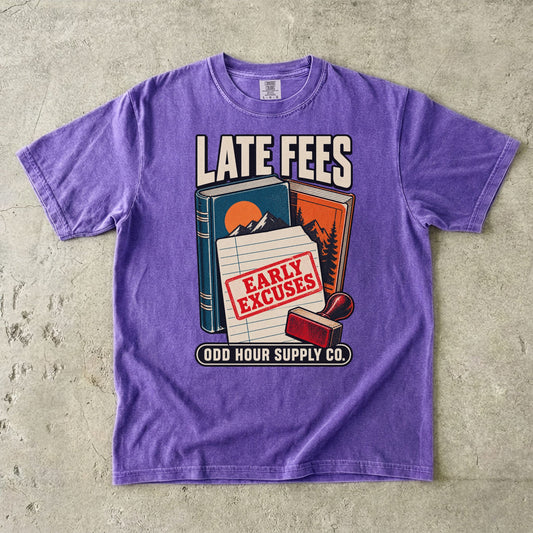 Violet T-shirt with books, a library card, a red stamp and LATE FEES EARLY EXCUSES by Odd Hour Supply Co.