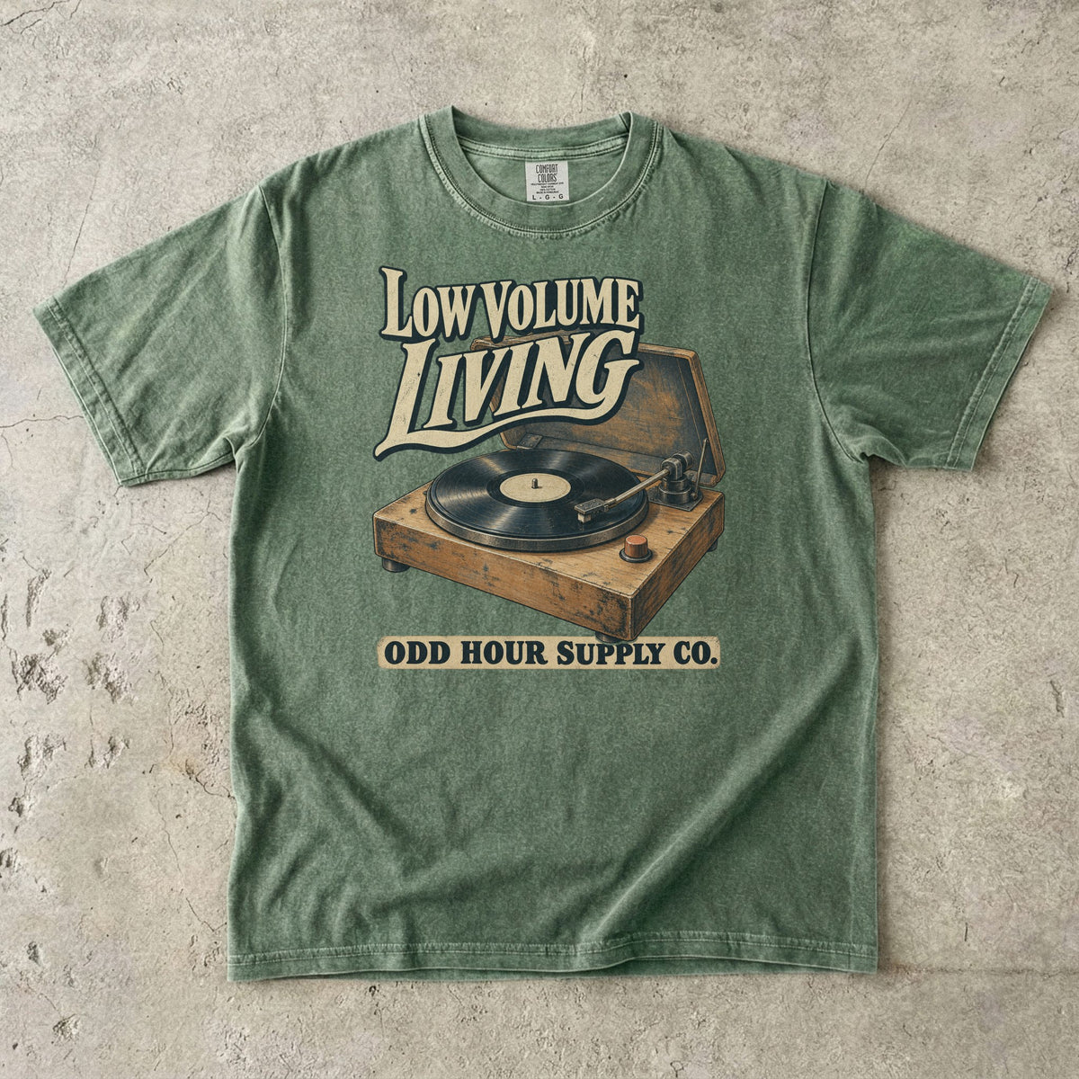 Moss Comfort Colors 1717 T-shirt with the Low Volume Living graphic, front view