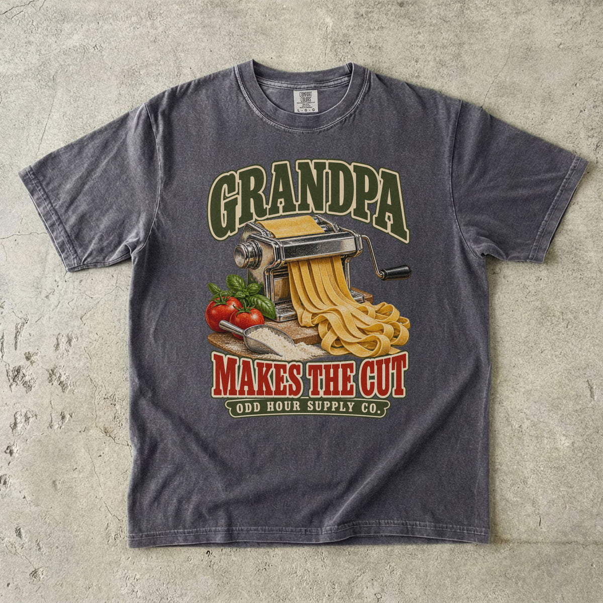 Pepper T-shirt with GRANDPA MAKES THE CUT, a pasta machine, noodles, tomatoes and basil by Odd Hour Supply Co.