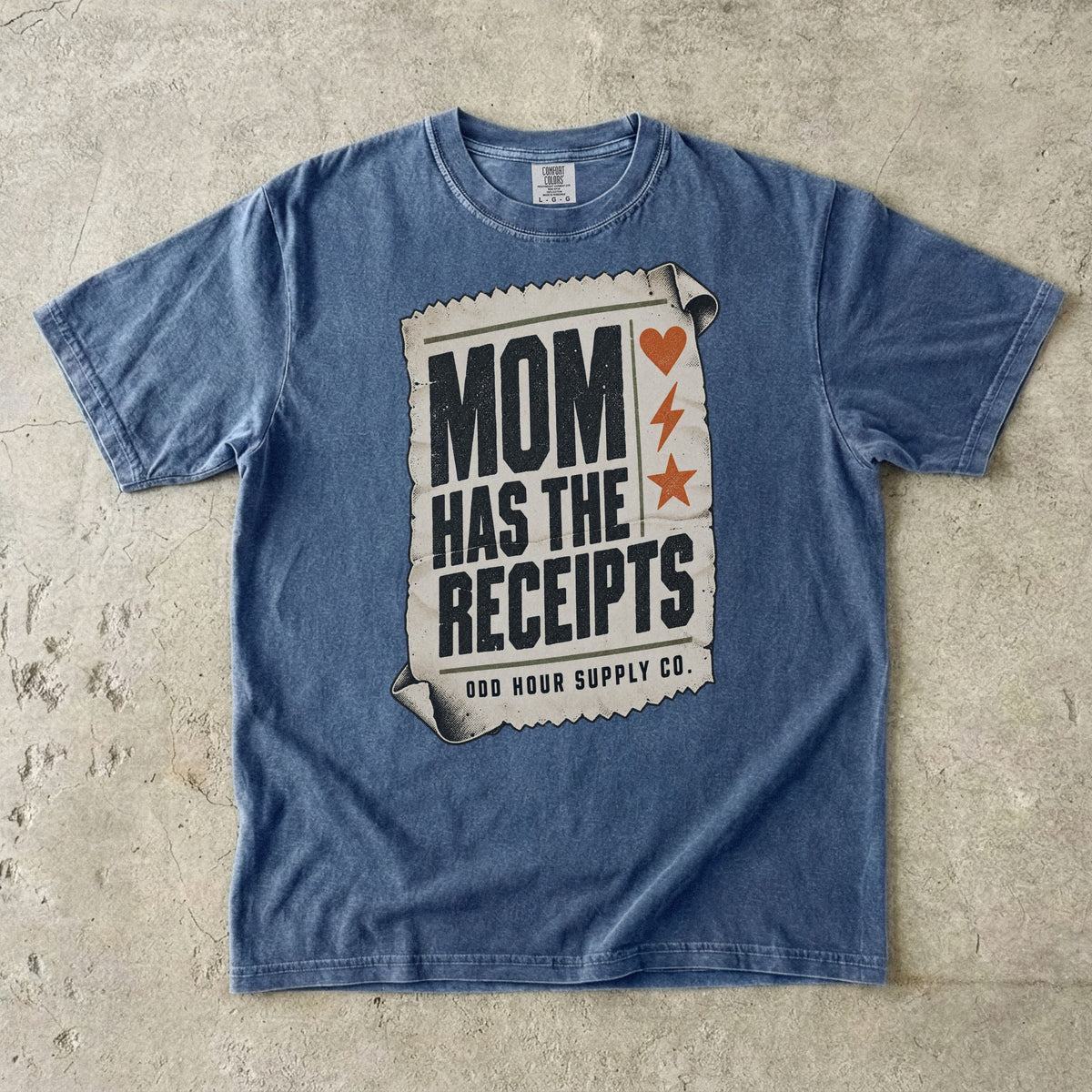 Denim Comfort Colors 1717 T-shirt with a cream receipt, black Mom Has the Receipts lettering, and orange heart, lightning bolt, and star symbols.