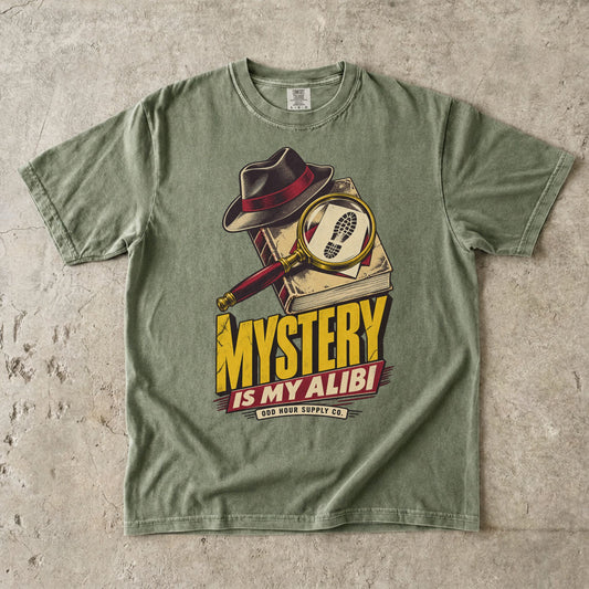 Hemp T-shirt with a detective hat, magnifying glass and yellow-red MYSTERY IS MY ALIBI by Odd Hour Supply Co.