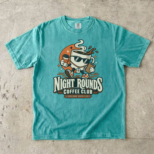Night Rounds Coffee Club retro coffee mascot on a Seafoam Comfort Colors T-shirt