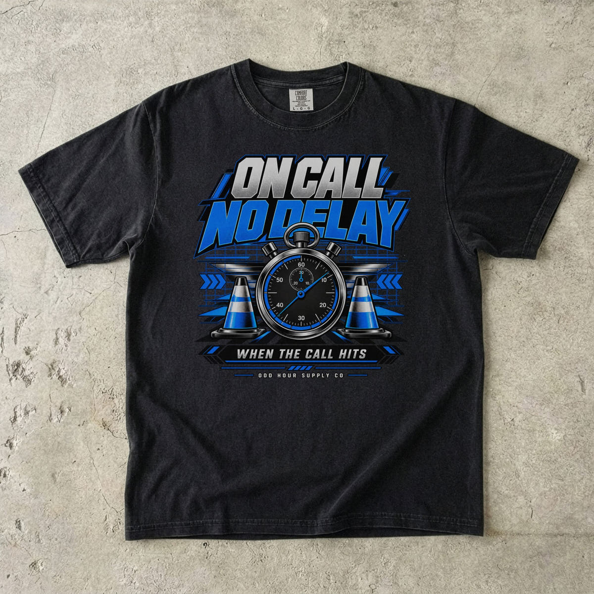 Black Comfort Colors 1717 T-shirt with On Call No Delay front graphic, blue stopwatch, cones and silver lettering.
