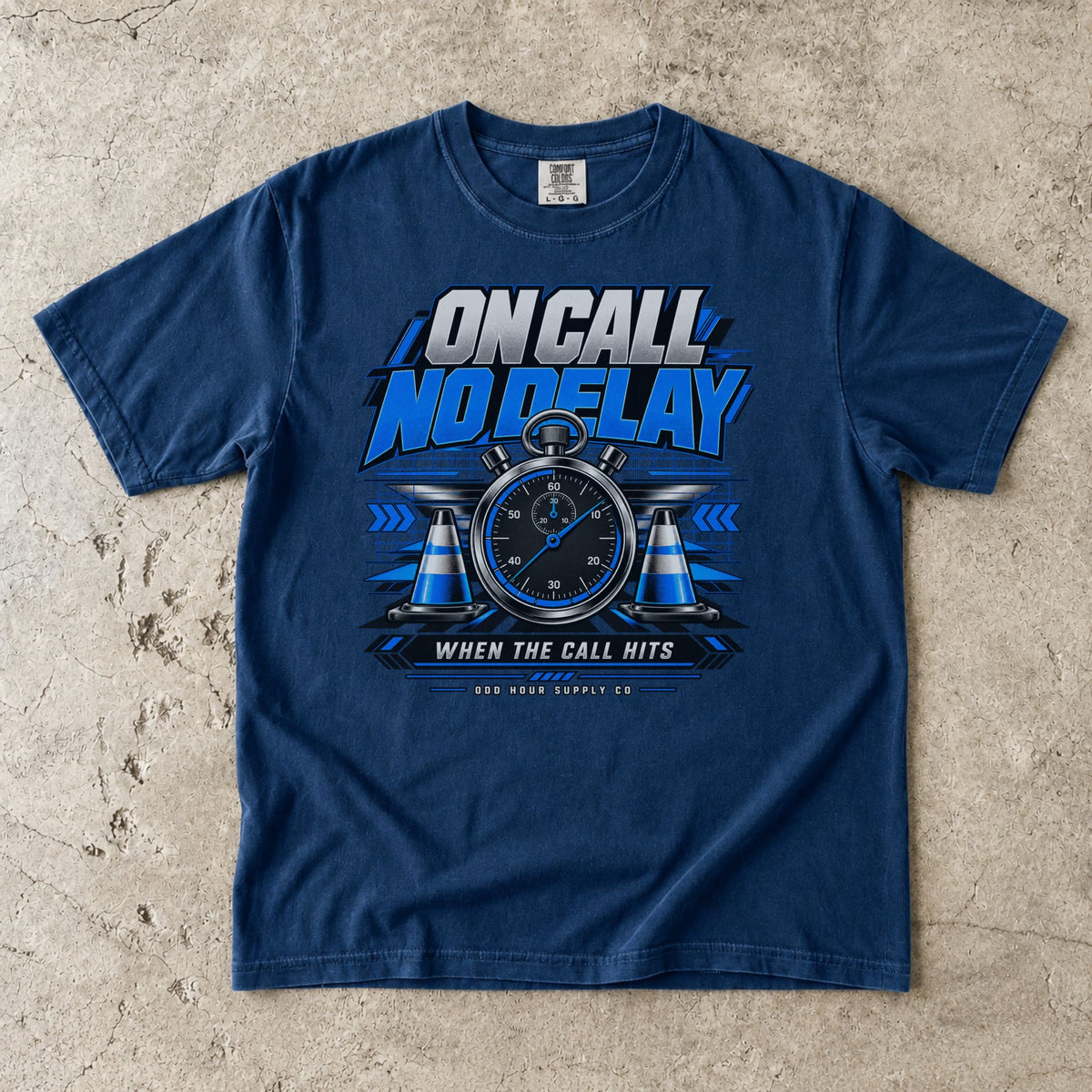 Navy Comfort Colors 1717 T-shirt with On Call No Delay front graphic, blue stopwatch, cones and silver lettering.
