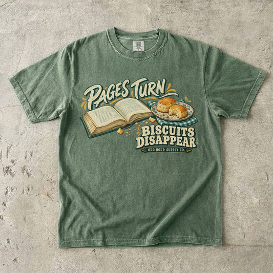 Moss T-shirt with an open book, biscuits and PAGES TURN BISCUITS DISAPPEAR by Odd Hour Supply Co.