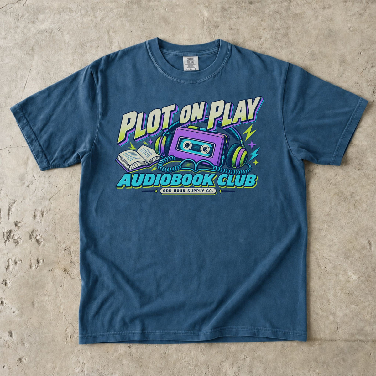 Midnight T-shirt featuring a purple cassette, headphones and PLOT ON PLAY AUDIOBOOK CLUB by Odd Hour Supply Co.