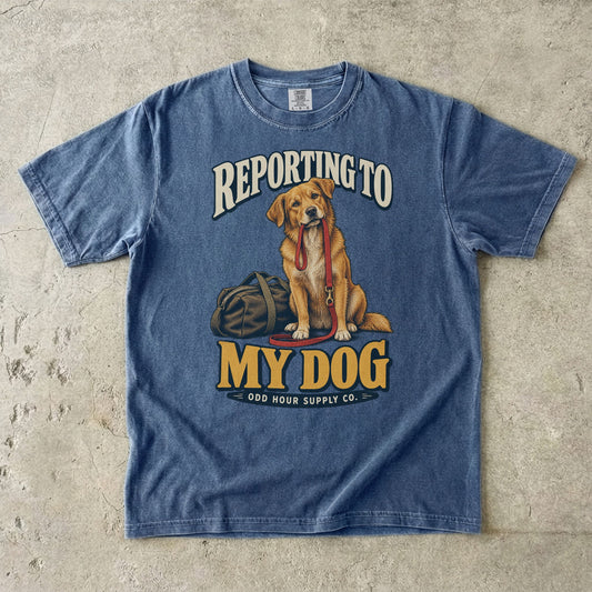 Denim T-shirt with a golden-brown dog, red leash and REPORTING TO MY DOG lettering by Odd Hour Supply Co.