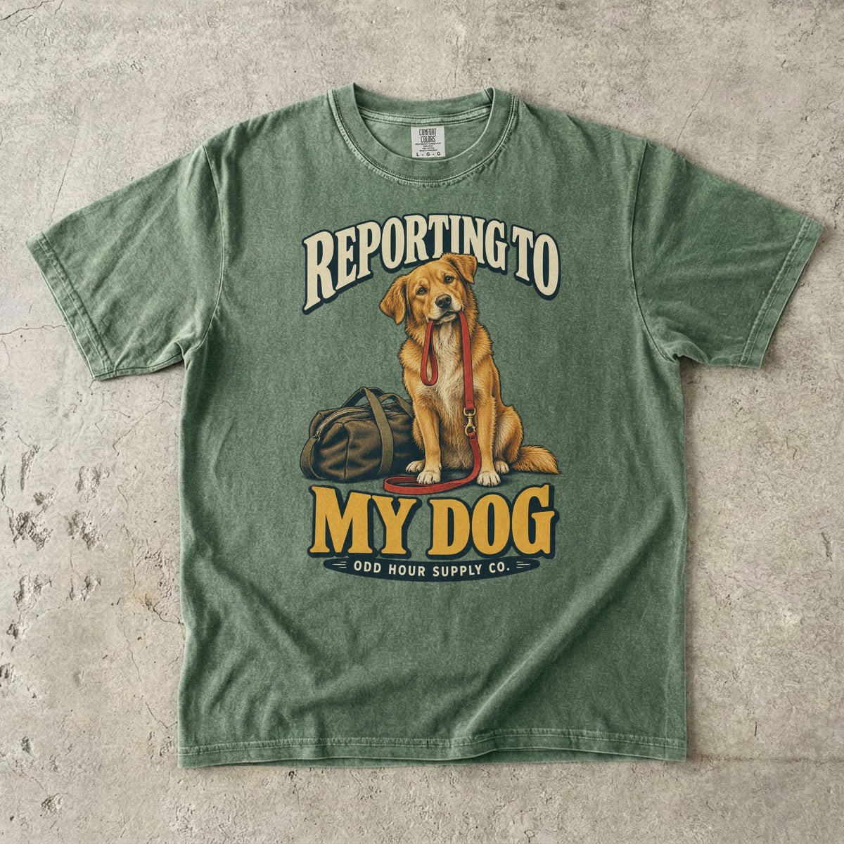 Moss T-shirt with a golden-brown dog, red leash and REPORTING TO MY DOG lettering by Odd Hour Supply Co.