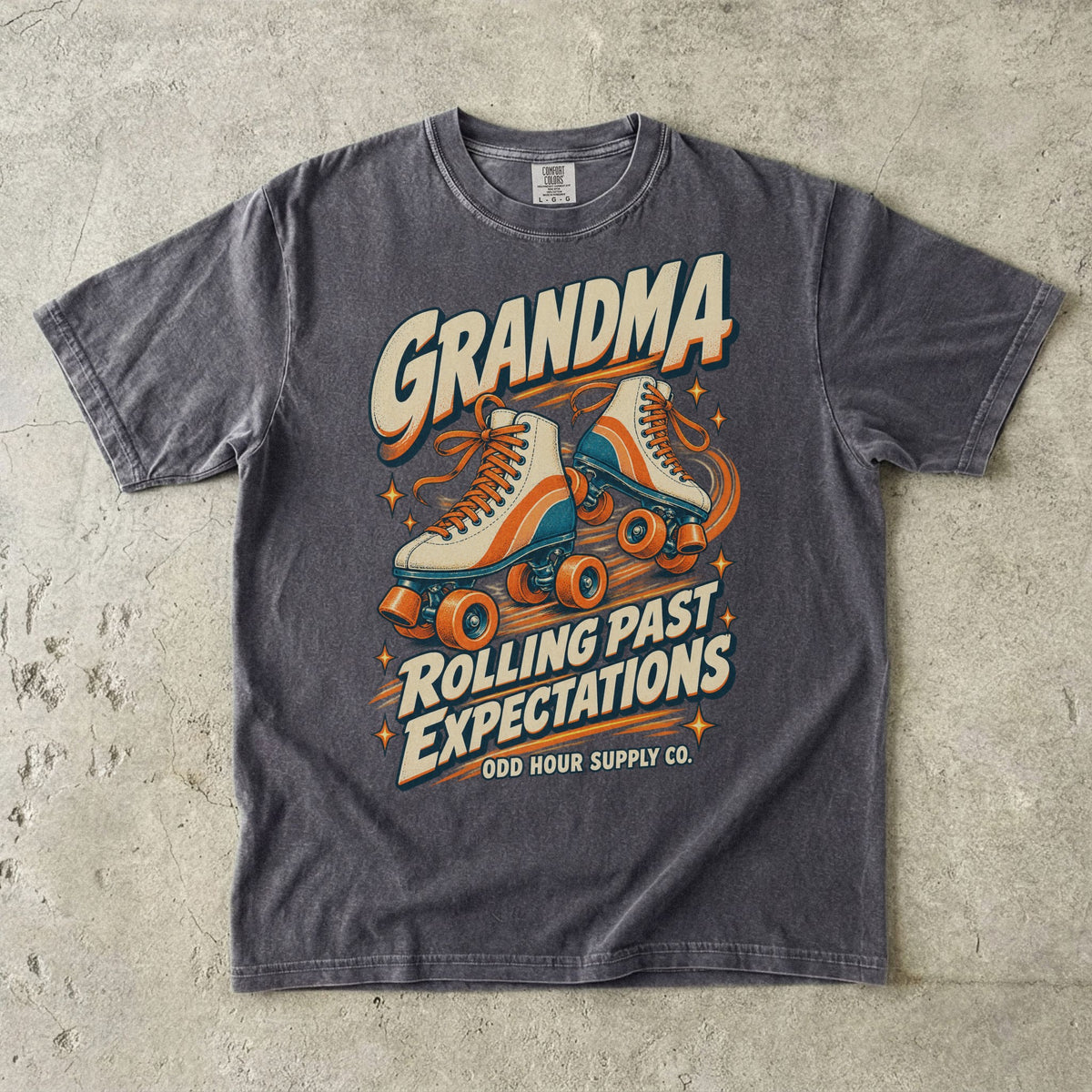 Pepper Comfort Colors 1717 T-shirt with cream roller skates, orange and teal details, and Grandma Rolling Past Expectations lettering.