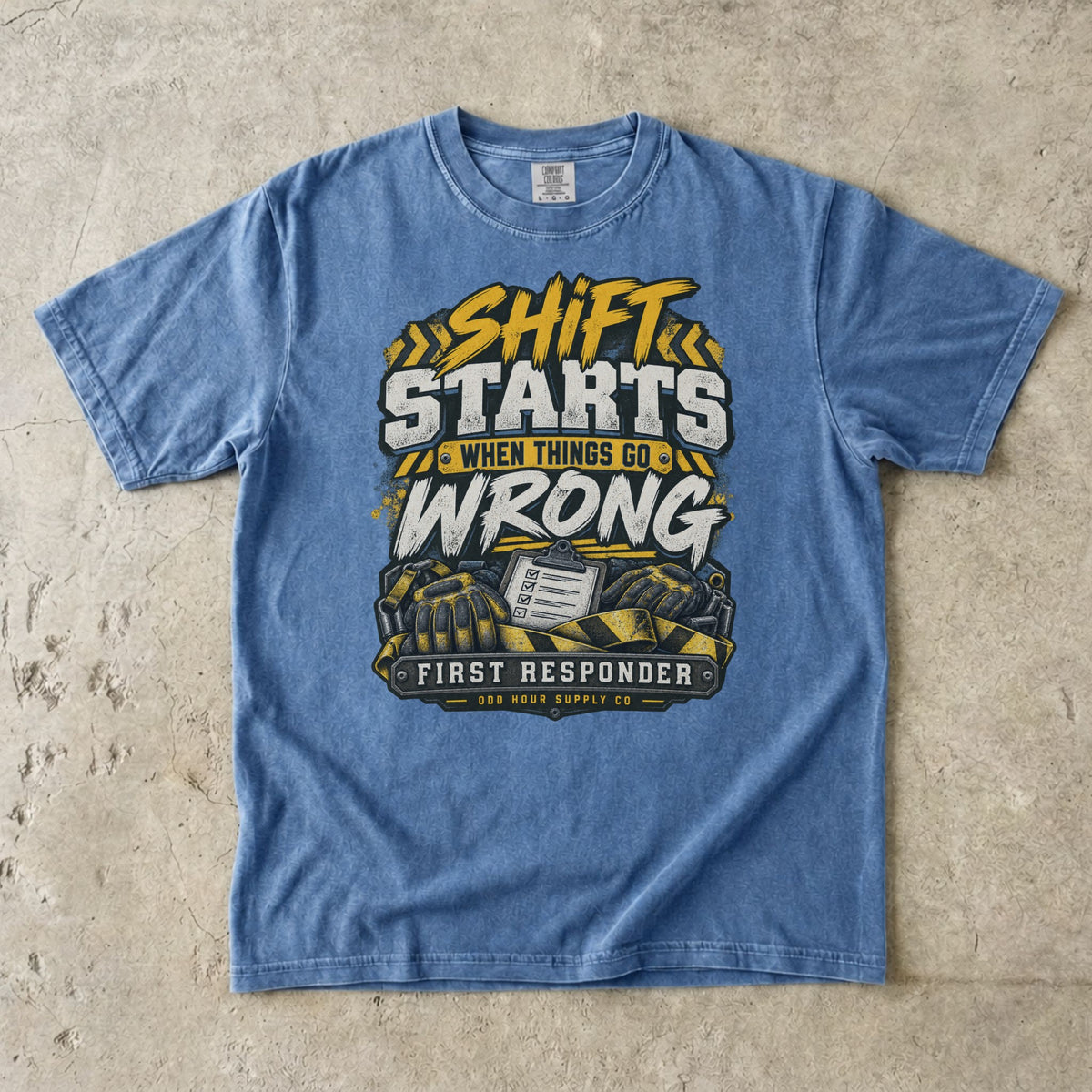 Washed Denim Comfort Colors 1717 T-shirt with Shift Starts When Things Go Wrong graphic, yellow hazard stripes, gloves and clipboard.