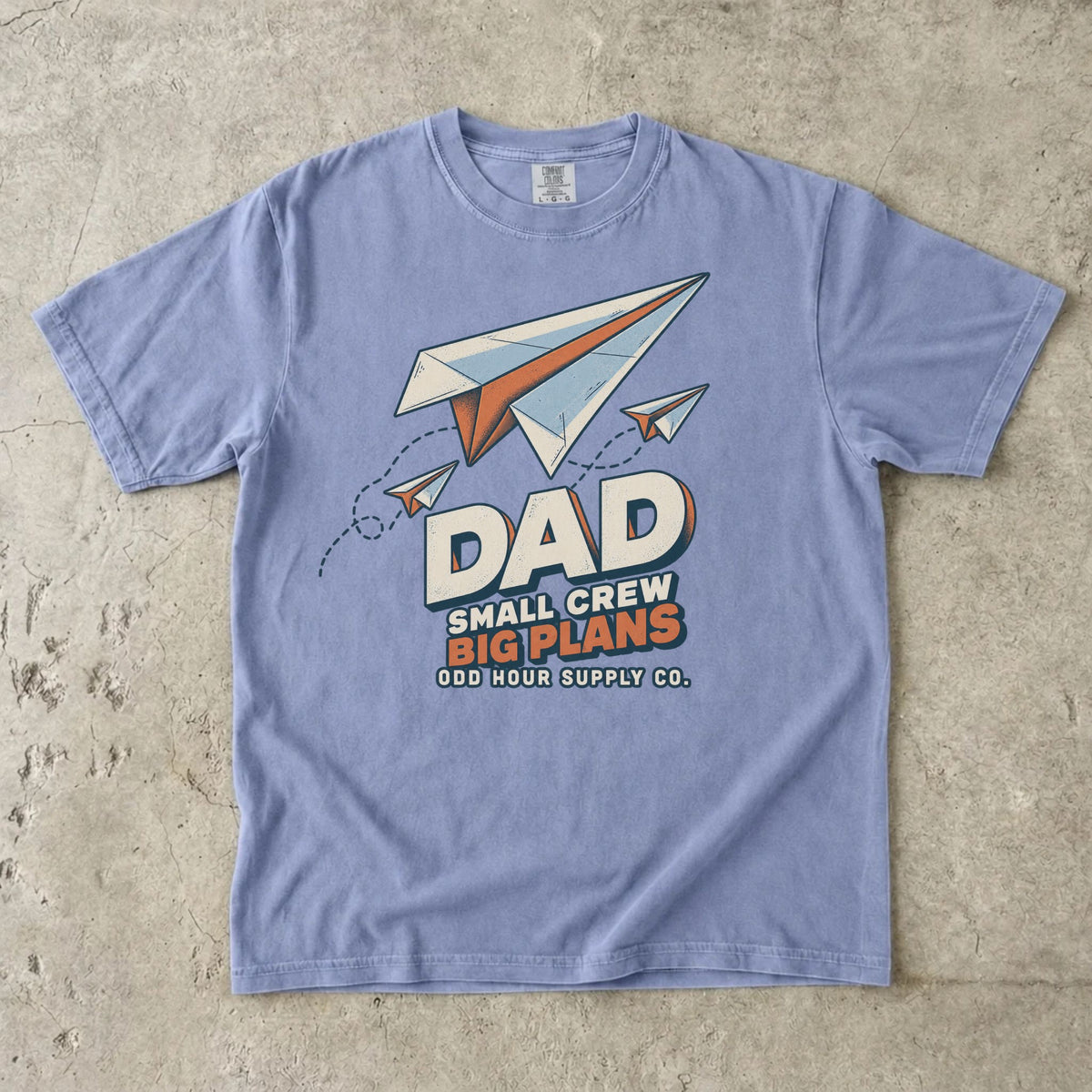 Ice Blue Comfort Colors 1717 T-shirt with three paper planes, dotted flight paths, and Dad Small Crew Big Plans lettering.