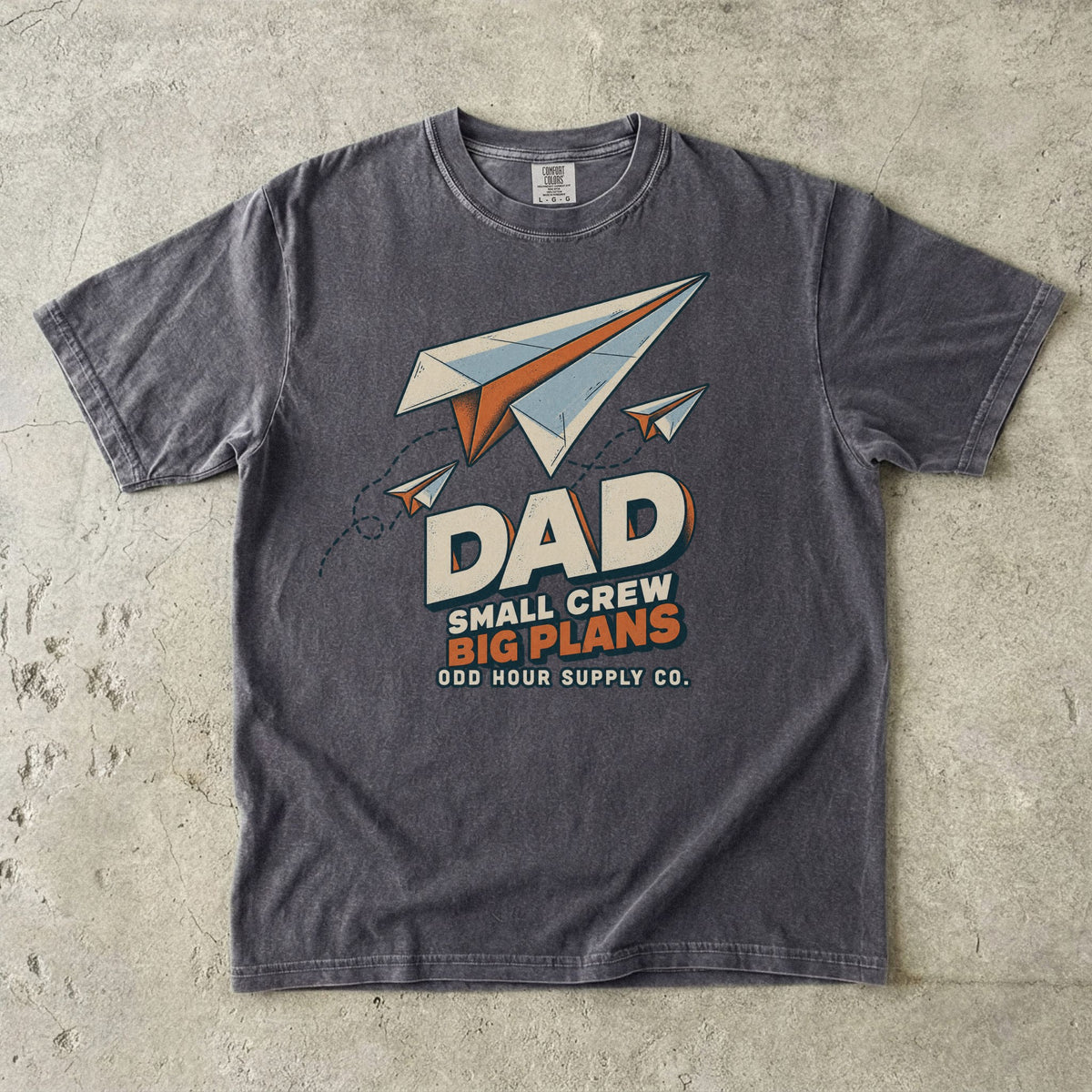 Pepper Comfort Colors 1717 T-shirt with three paper planes, dotted flight paths, and Dad Small Crew Big Plans lettering.