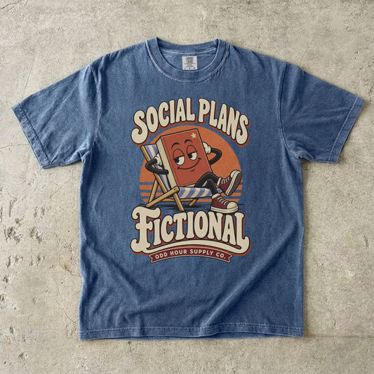 Denim T-shirt featuring a lounging book character and SOCIAL PLANS FICTIONAL by Odd Hour Supply Co.