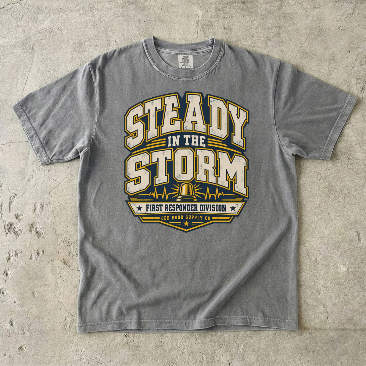 Granite Comfort Colors 1717 T-shirt with Steady in the Storm college graphic, yellow beacon, pulse lines and First Responder Division text.