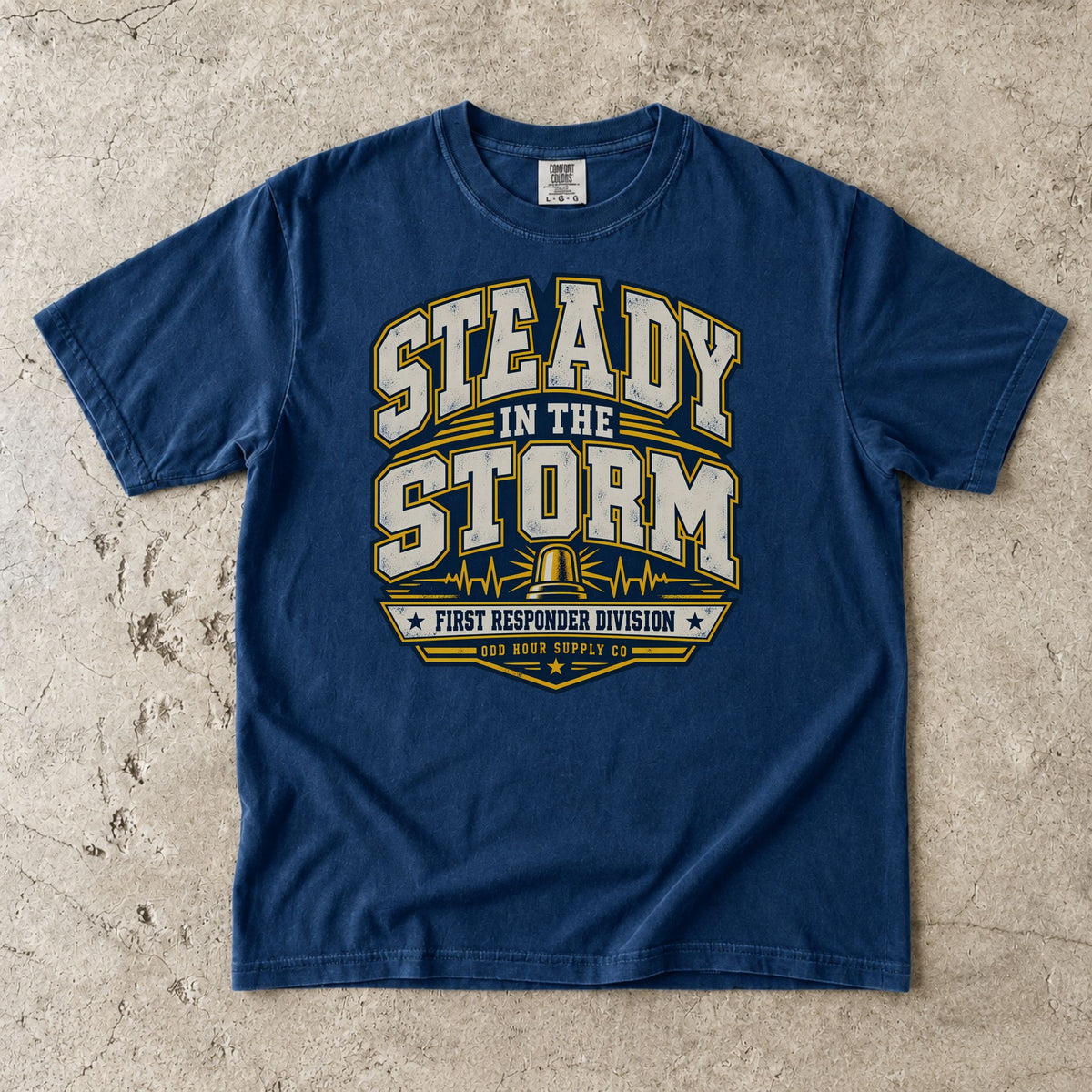 Navy Comfort Colors 1717 T-shirt with Steady in the Storm college graphic, yellow beacon, pulse lines and First Responder Division text.