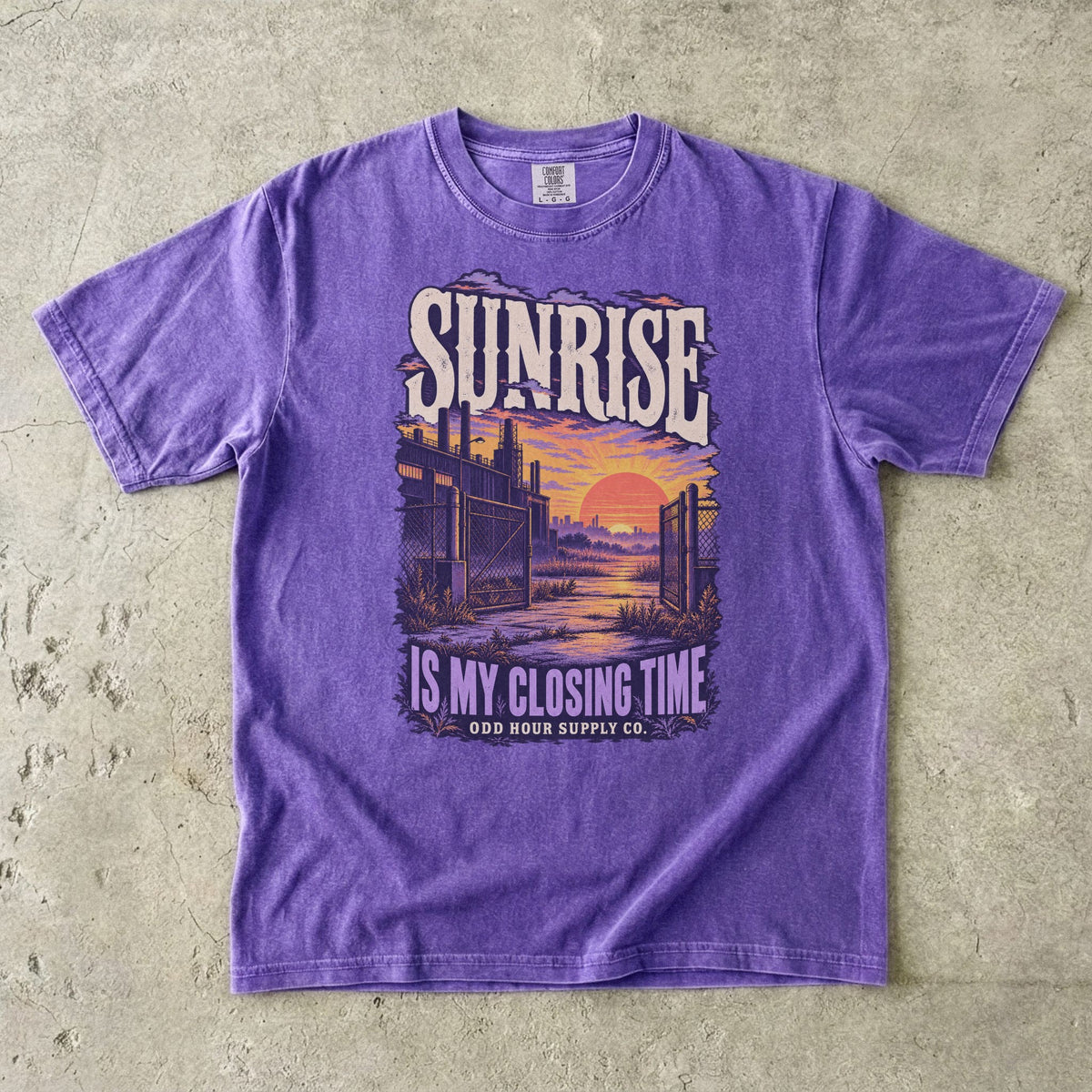 Violet T-shirt with a purple and orange sunrise and SUNRISE IS MY CLOSING TIME by Odd Hour Supply Co.