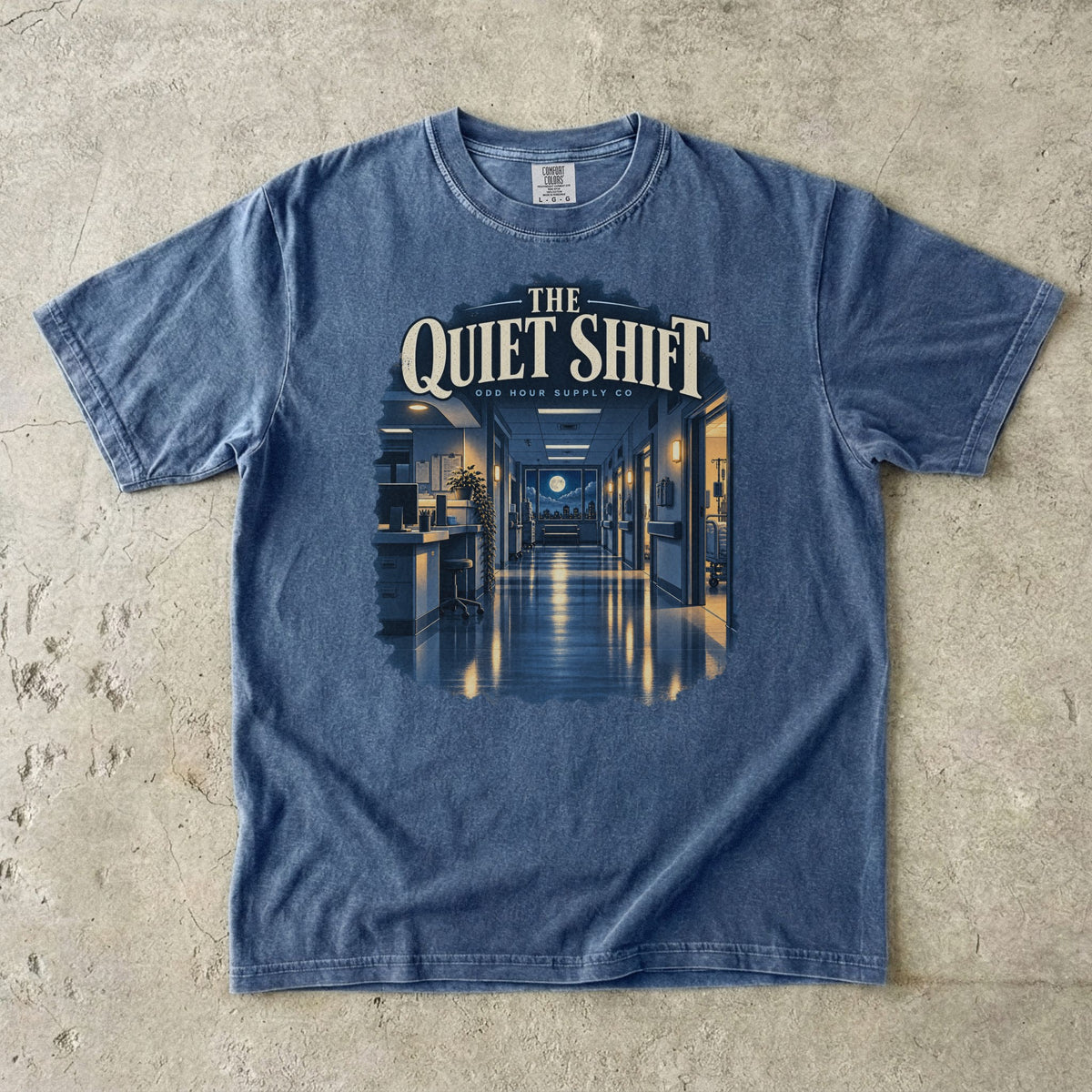 The Quiet Shift hospital corridor graphic on a Denim Comfort Colors 1717 T-shirt