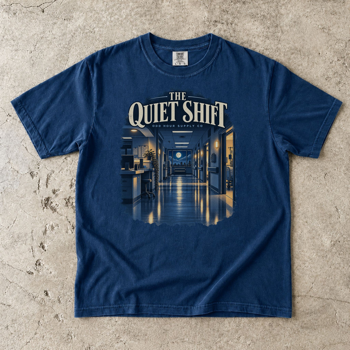 The Quiet Shift hospital corridor graphic on a Navy Comfort Colors 1717 T-shirt