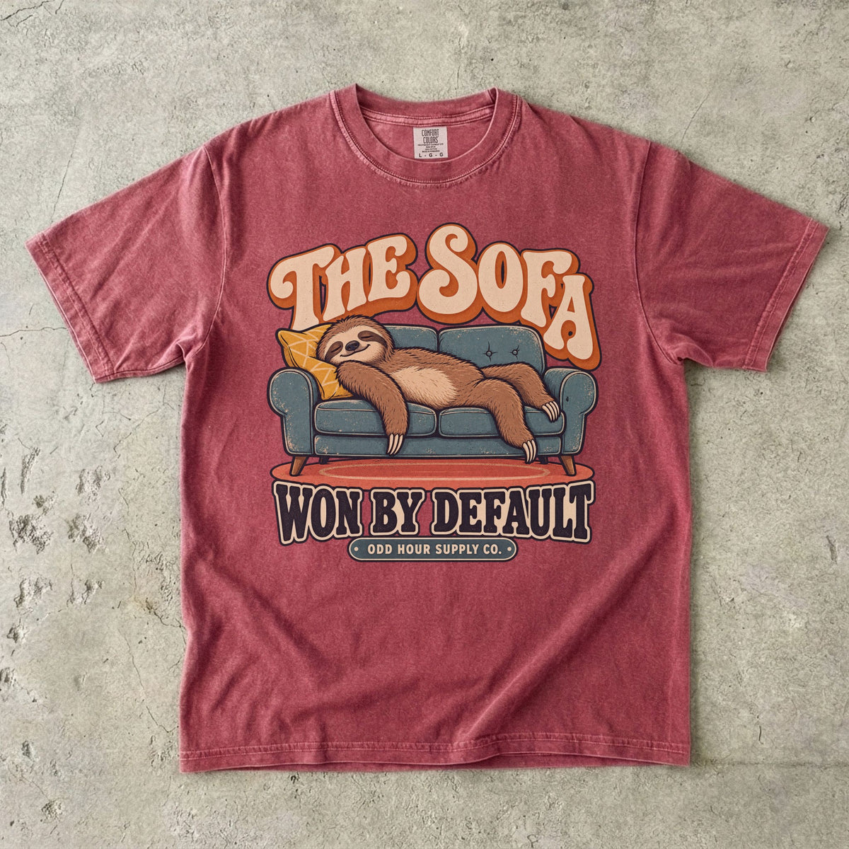 Brick T-shirt with a lounging sloth on a sofa and THE SOFA WON BY DEFAULT by Odd Hour Supply Co.