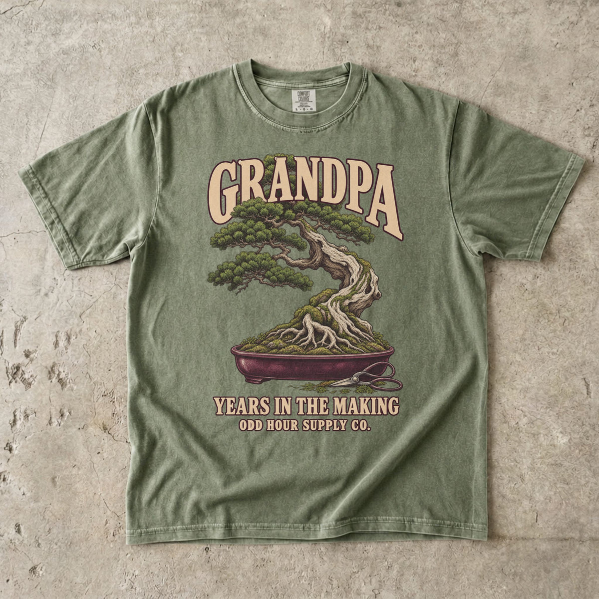 Hemp T-shirt with GRANDPA YEARS IN THE MAKING, a bonsai tree, exposed roots and small pruning shears by Odd Hour Supply Co.