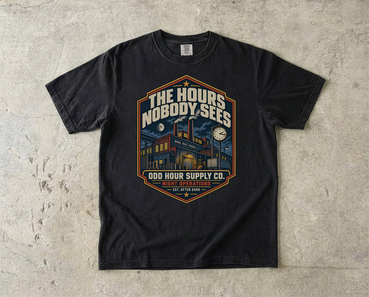 The Hours Nobody Sees vintage badge T-shirt in Black, Comfort Colors 1717 front view