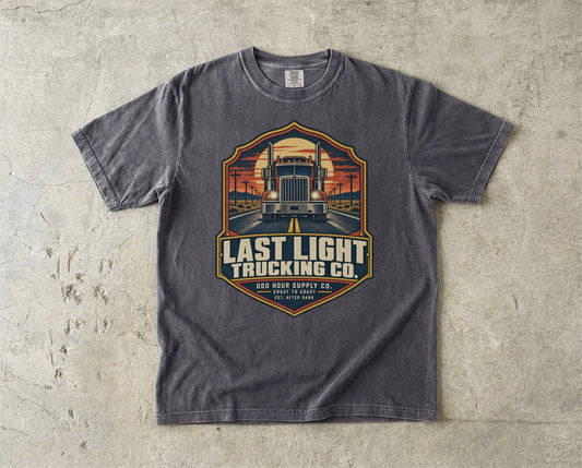 Last Light Trucking Co. vintage badge T-shirt in Pepper, Comfort Colors 1717 front view